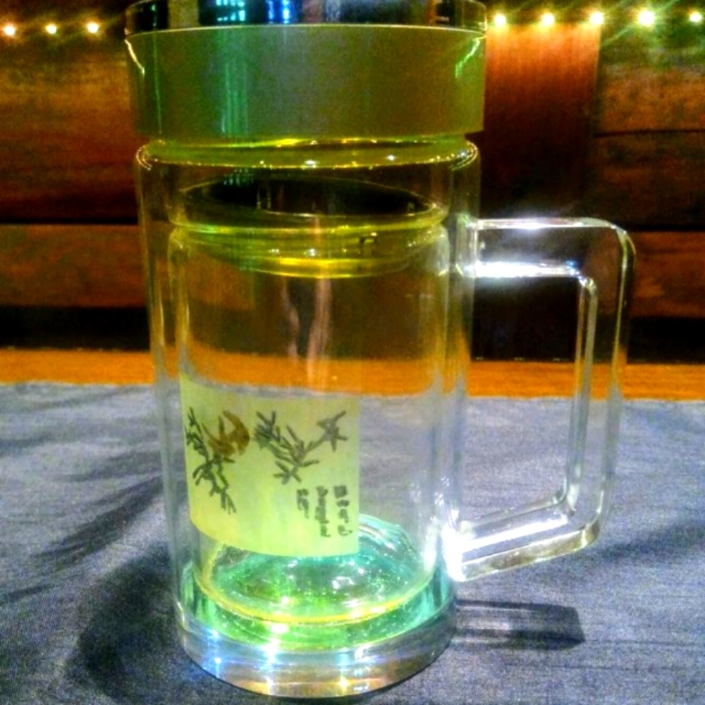 Art glass unique portable drinking ware, thermos and strainer.